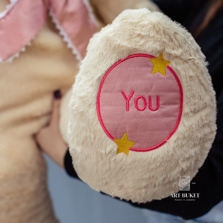 Медведь бежевый с розовым бантом 90 см