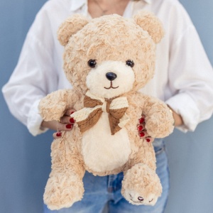 Медведь с бантом кучерявый 40 см бежевый