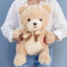 Медведь с бантом кучерявый 40 см бежевый